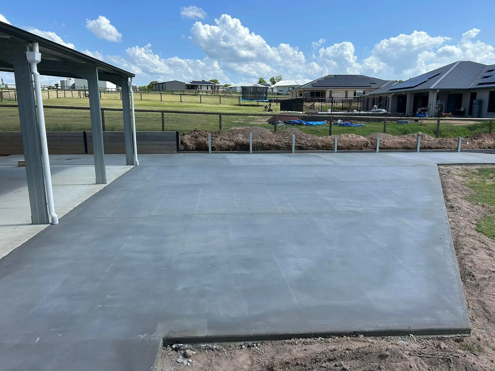 Patio slab beside a carport