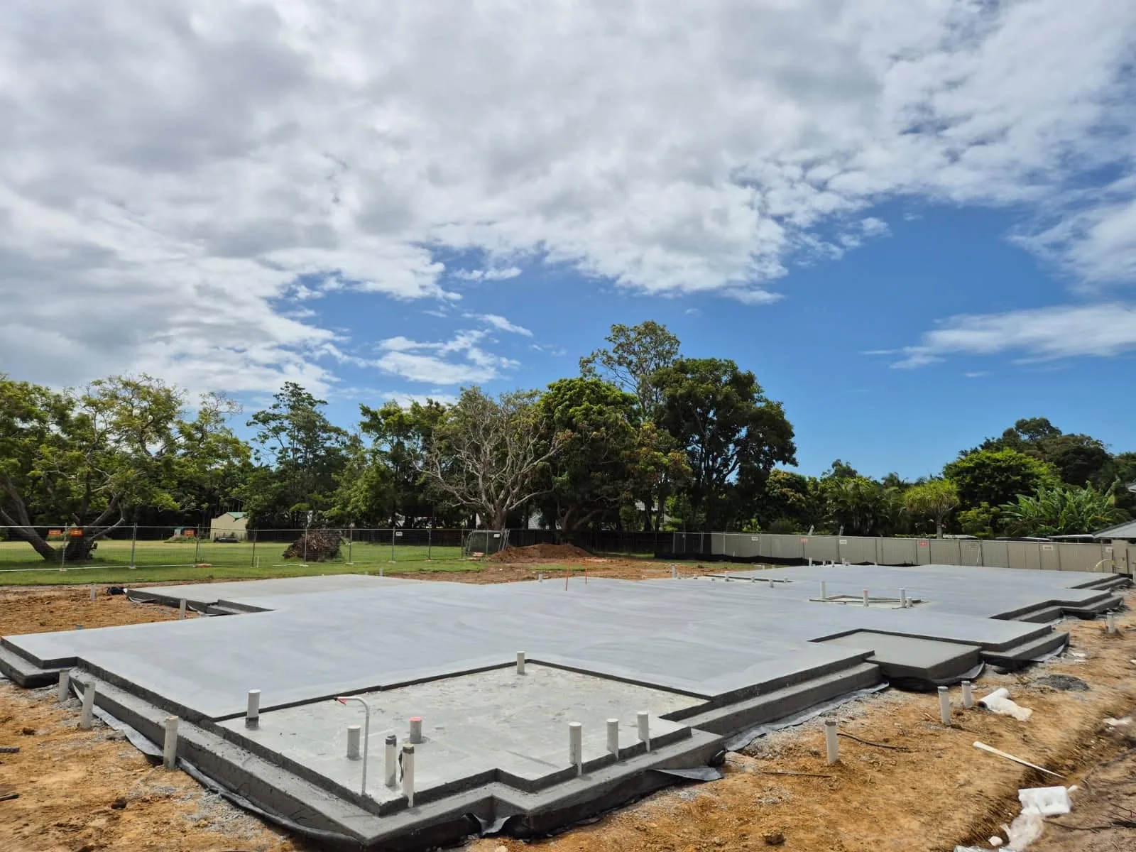 Stepped house slab with plumbing penetrations