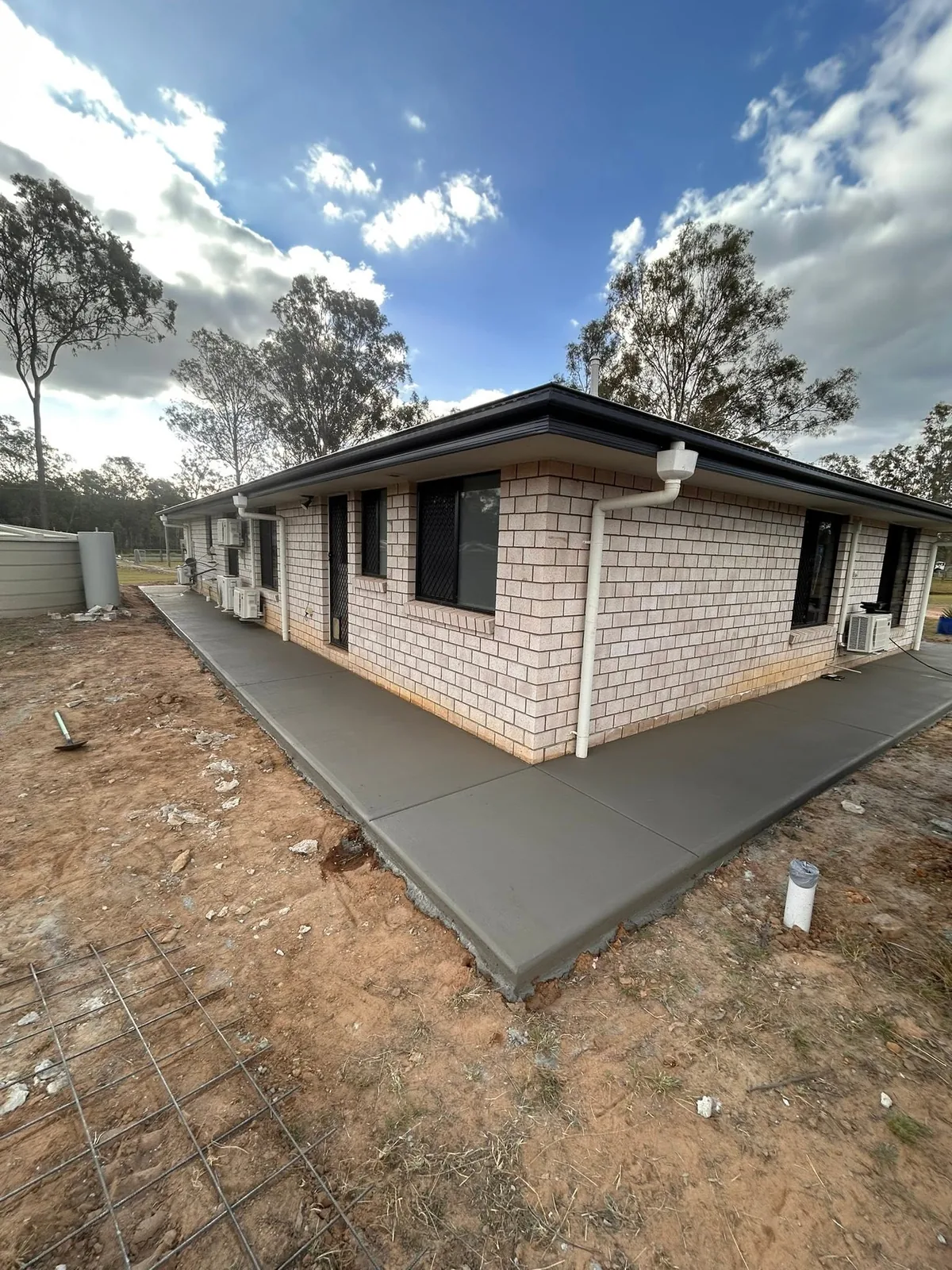 Concrete surround on a brick house
