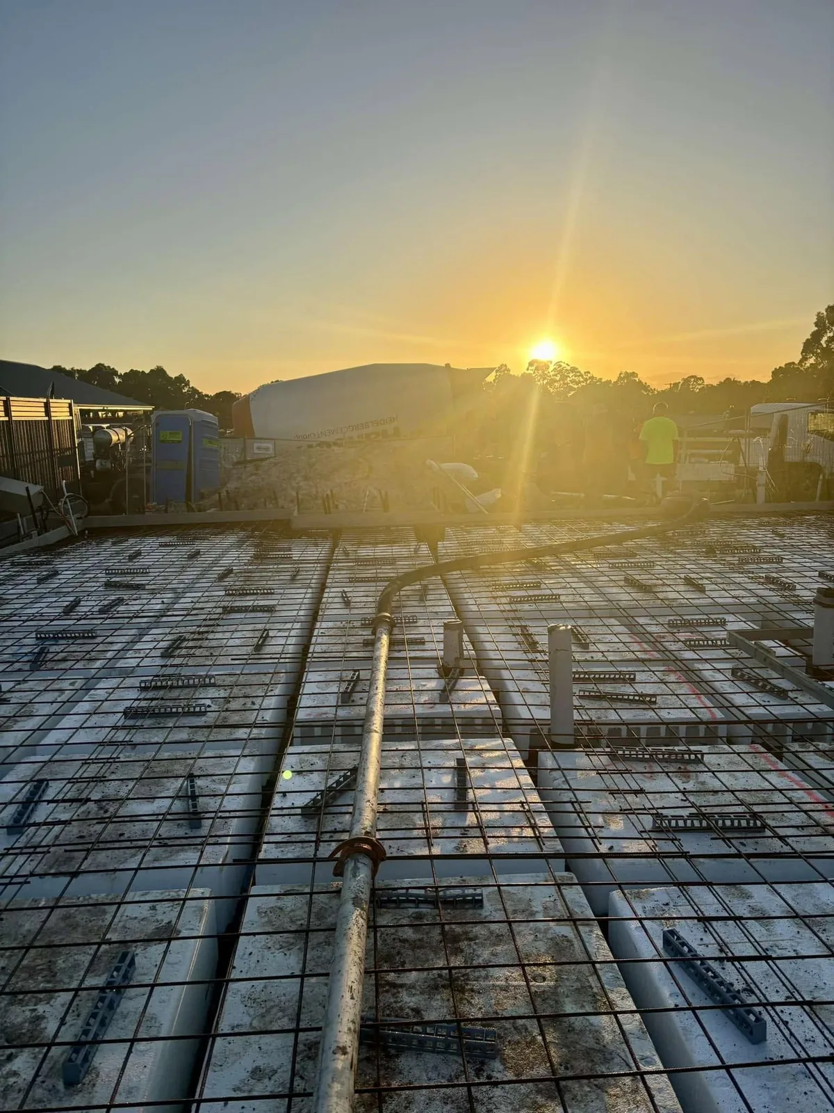 Mesh and pods at sunrise with concrete truck
